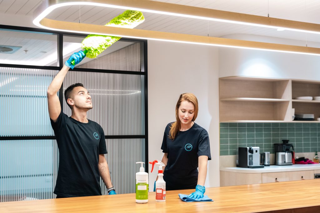 commercial cleaning team in office